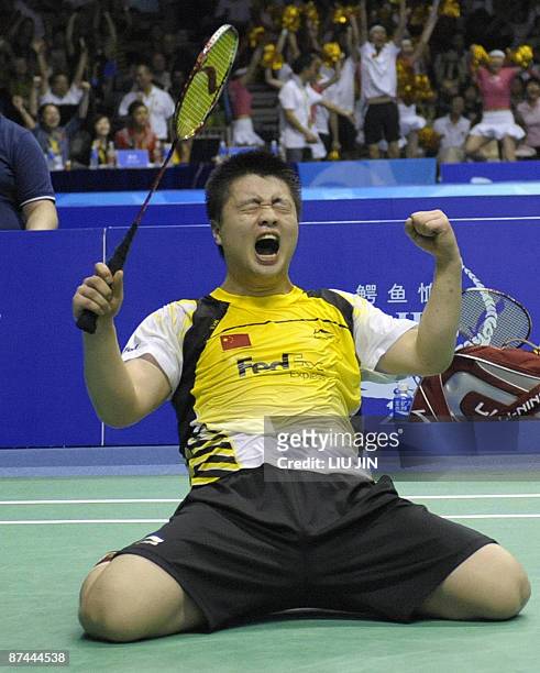 China's Zheng Bo celebrates after beating South Korea's Lee Yong Dae and Lee Hyo Jung during the mixed doubles final match at the Sudirman Cup world...