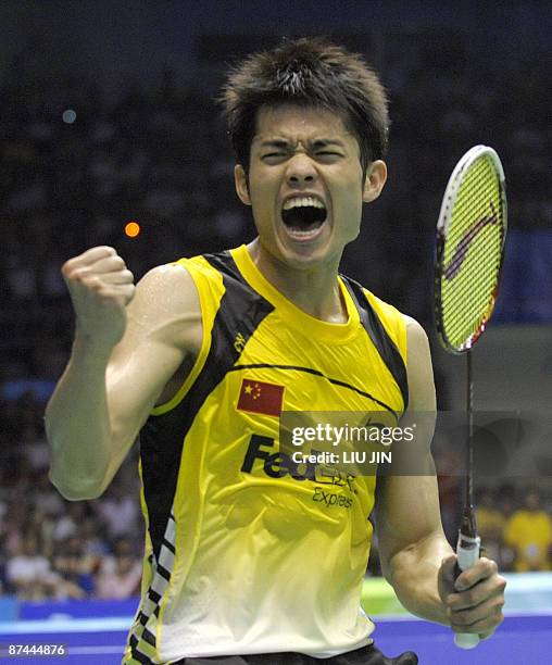 China's Lin Dan celebrates after defeating South Korea's Park Sung Hwan during the men's singles final match at the Sudirman Cup world badminton...