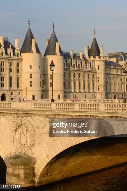 The Conciergerie in Paris along the banks of the Seine. The Conciergerie is a former royal palace and prison in Paris, located on the west of the Île...