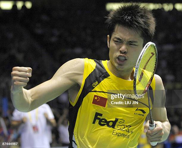 China's Lin Dan celebrates after defeating South Korea's Park Sung Hwan during the men's singles final match at the Sudirman Cup world badminton...