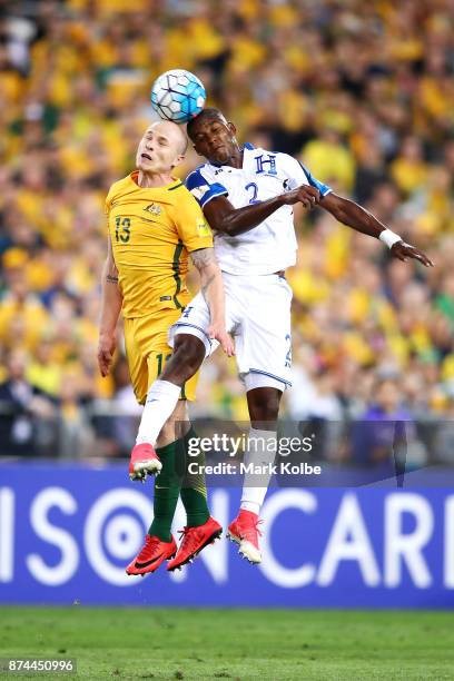 Aaron Mooy of Australia and Brayan Beckeles of Honduras compete for the ball in the air during the 2018 FIFA World Cup Qualifiers Leg 2 match between...