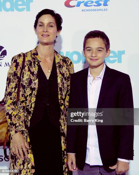 Actress Carrie-Anne Moss and son Jaden Roy attend the premiere of Lionsgates's' 'Wonder' at Regency Village Theatre on November 14, 2017 in Westwood,...