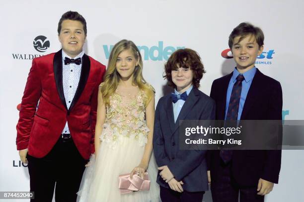 Actors Ty Consiglio, Elle McKinnon, Kyle Breitkopf and James A. Hughes attend the premiere of Lionsgates's' 'Wonder' at Regency Village Theatre on...