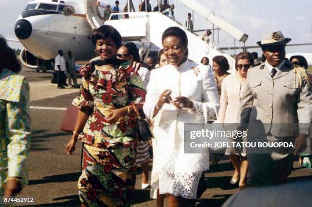Zimbabwean First Lady Grace Mugabe , is welcomed by her Gabonese counterpart Edith Lucie Bongo 16 May 2001 at Libreville international airport. They...