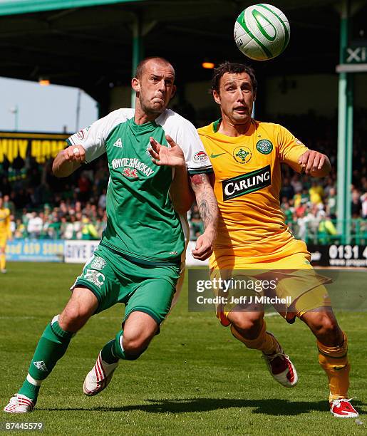 Steven Fletcher of Hibernian tackles Scott McDonald of Celtic during the Scottish Premier League match between Hibernian and Celtic at Easter Road on...