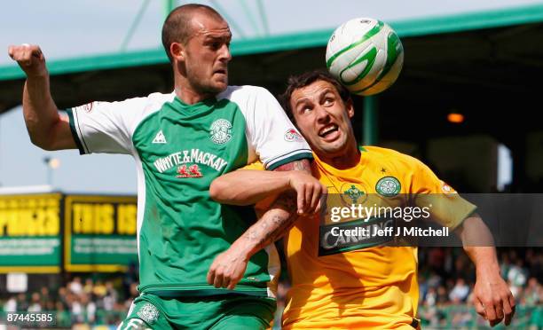 Steven Fletcher of Hibernian tackles Scott McDonald of Celtic during the Scottish Premier League match between Hibernian and Celtic at Easter Road on...