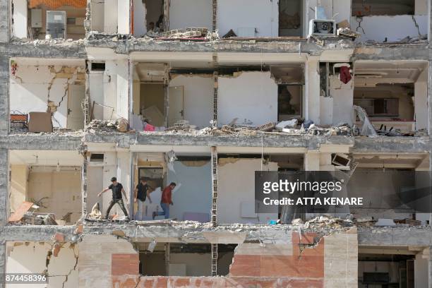 Picture taken on November 15, 2017 shows a view through the buildings left damaged by a 7.3-magnitude earthquake that struck days before in the town...