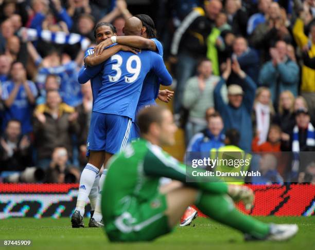 Florent Malouda of Chelsea celebrates scoring the first goal of the game with Didier Drogba and Nicolas Anelka as Blackburn goalkeeper Paul Robinson...