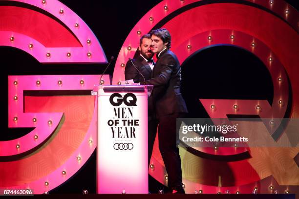 Daniel MacPherson and RJ Mitte embrace during the GQ Men Of The Year Awards Ceremony at The Star on November 15, 2017 in Sydney, Australia.