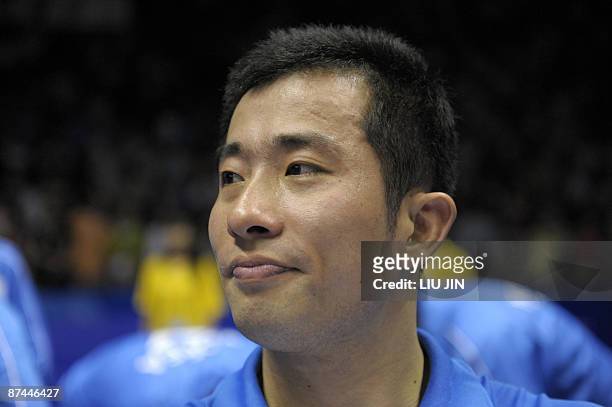 South Korea's Jung Jae Sung holds his emotion after being defeated by China's Cai Yun and Fu Haifeng during the men's doubles final match at the...