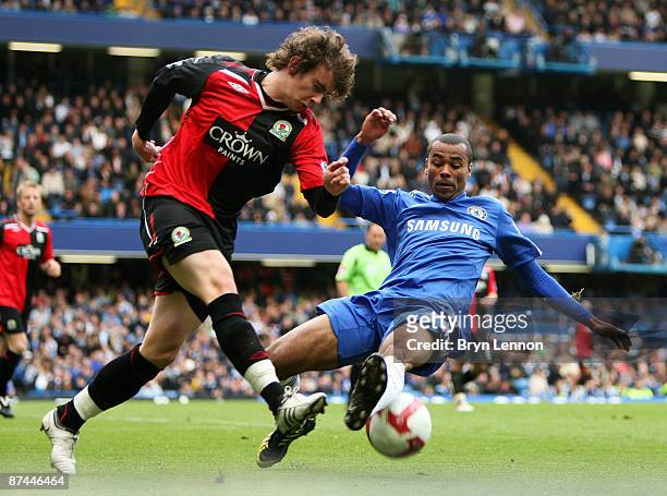 Ashley Cole of Chelsea attempts to block Aaron Doran of Blackburn during the Barclays Premier League match between Chelsea and Blackburn Rovers at...