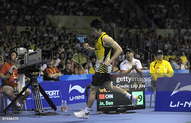 China's Lin Dan reacts to a winning point against South Korea's Park Sung Hwan during the men's singles final match at the Sudirman Cup world...