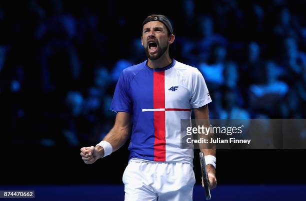 Lukasz Kubot of Poland partner of Marcelo Melo of Brazil celebrates victory during the doubles match against Mike Bryan of The United States and Bob...