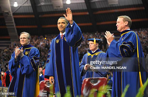 President Barack Obama waves as he arrives on the stage May 17, 2009 to attend the commencement ceremony in the Joyce Center of Notre Dame University...