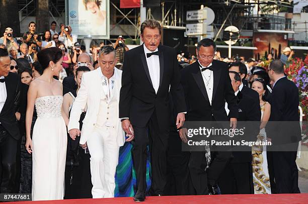 Actress Michelle Ye, actor Anthony Wong, actor and musician Johnny Hallyday and director Johnnie To lead the cast and crew as they arrive at the...