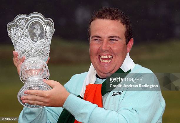 Shane Lowry of Ireland with the winners trophy after winning on the third play-off hole during the final round of The 3 Irish Open at County Louth...