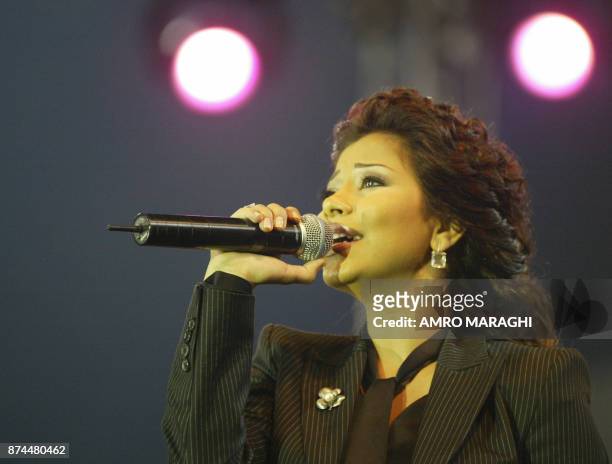 Egyptian singer Sherine Abdel Wahab performs prior to the football game between Egypt and Lebanon and Arab stars in support of Lebanon at Cairo...
