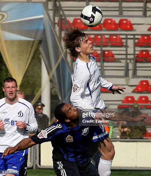 Zelao of FC Saturn Moscow Oblast battles for the ball with Aleksandr Kokorin of FC Dynamo Moscow during the Russian Football League Championship...