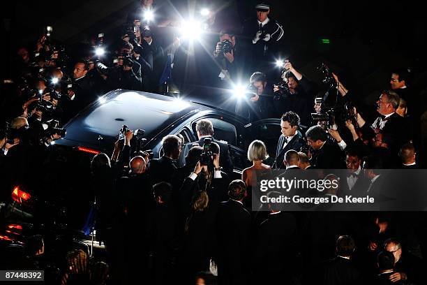 Photographers surround the car as Johnny Hallyday departs the Vengeance Premiere at the Palais Des Festivals during the 62nd International Cannes...