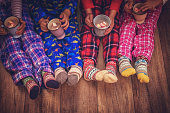 Cute Little Kids in Pyjamas and Christmas Socks Drinking Hot Chocolate with Marshmallows for Christmas