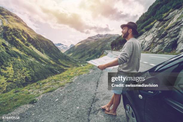 young man traveling in switzerland, road trip - offbeat stock pictures, royalty-free photos & images