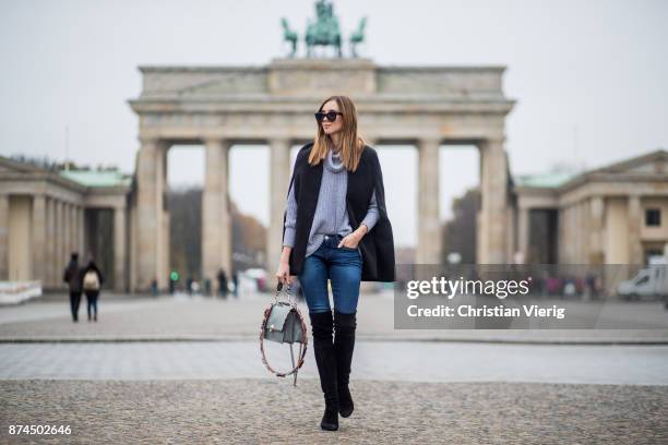Barbora Ondrackova wearing American Apparel turtleneck knit, black Stuart Weitzman overknee boots, Fendi bag, Celine sunglasses, True Religion denim...