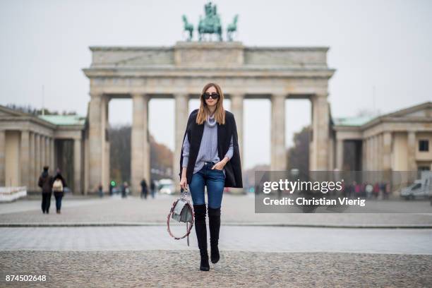 Barbora Ondrackova wearing American Apparel turtleneck knit, black Stuart Weitzman overknee boots, Fendi bag, Celine sunglasses, True Religion denim...