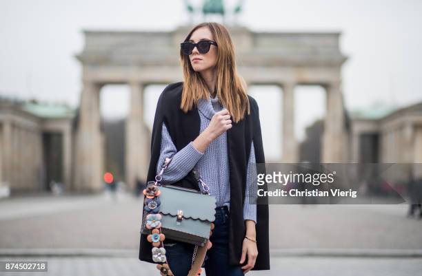 Barbora Ondrackova wearing American Apparel turtleneck knit, black Stuart Weitzman overknee boots, Fendi bag, Celine sunglasses, True Religion denim...