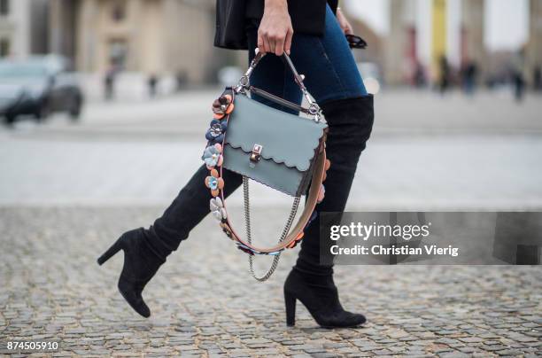 Barbora Ondrackova wearing American Apparel turtleneck knit, black Stuart Weitzman overknee boots, Fendi bag, Celine sunglasses, True Religion denim...