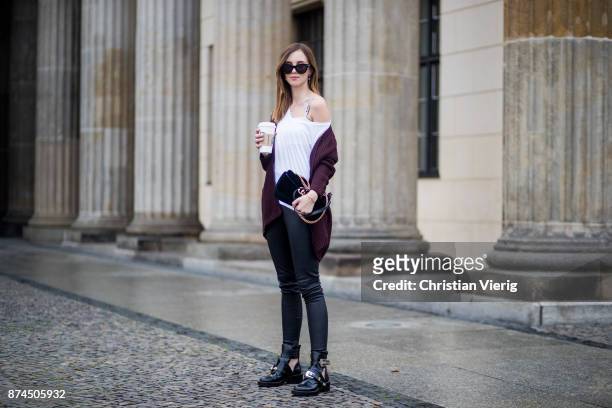 Barbora Ondrackova with a coffee to go wearing white tshirt Topshop, black Balenciaga leggings, a bordeaux Topshop cardigan, Dior bralette, black...