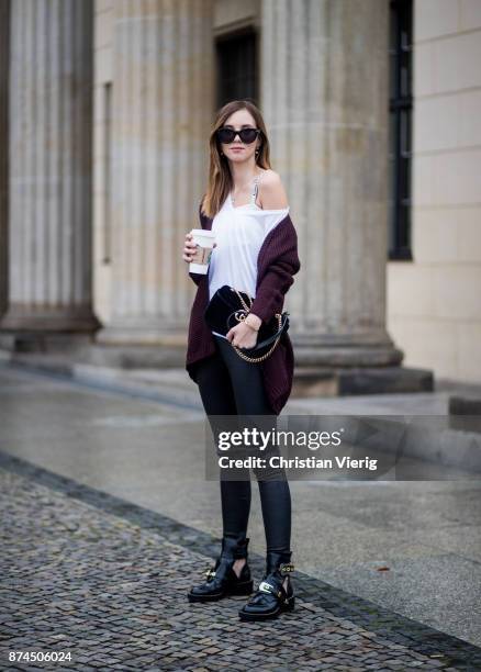 Barbora Ondrackova with a coffee to go wearing white tshirt Topshop, black Balenciaga leggings, a bordeaux Topshop cardigan, Dior bralette, black...