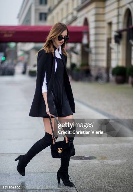 Barbora Ondrackova wearing white Topshop shirt, black Asos dress, black Missguided cape, black Stuart Weitzman overknee boots, black Gucci bag, black...