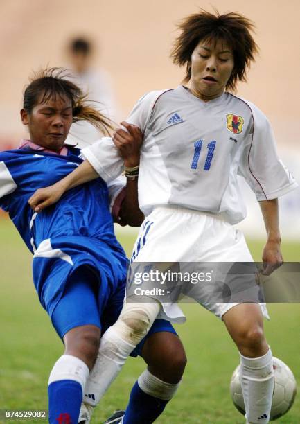 Otani Mio of Japan clashes with Lin Yu-Hui of Taiwan during a Group B first round match between Japan and Chinese Taipei during the AFC Women's...