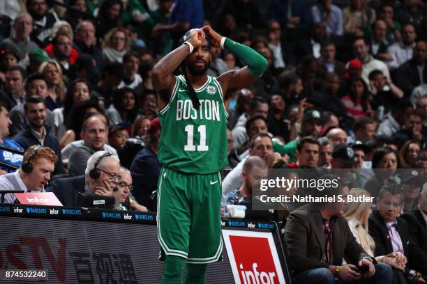 Kyrie Irving of the Boston Celtics fixes his mask during the game against the Brooklyn Nets on November 14, 2017 at Barclays Center in Brooklyn, New...