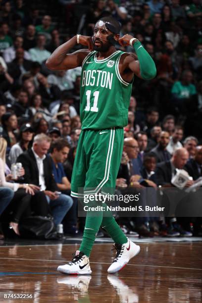 Kyrie Irving of the Boston Celtics fixes his mask during the game against the Brooklyn Nets on November 14, 2017 at Barclays Center in Brooklyn, New...