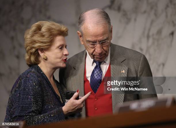 Sen. Debbie Stabenow speaks with Sen. Chuck Grassley during a markup of the Republican tax reform proposal November 14, 2017 in Washington, DC....