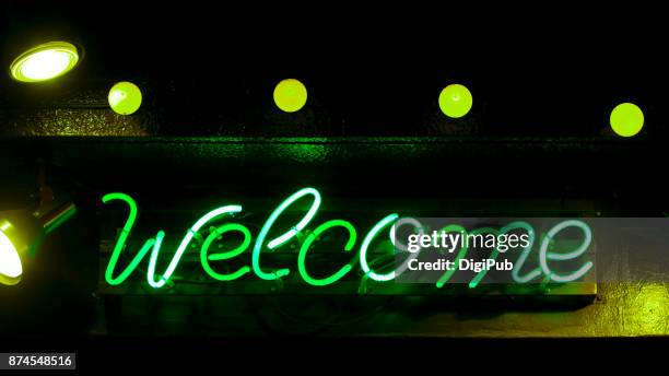 green neon sign - welcome - welcome sign ストックフォトと画像