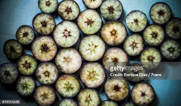 blueberry cross sections on a blue plate - cross section stock photos et images de collection