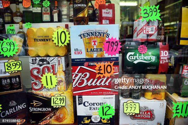 Bottles and cans of liquor are displayed with price tags in a shop window in Glasgow on November 15, 2017. Britain's top court on November 15...