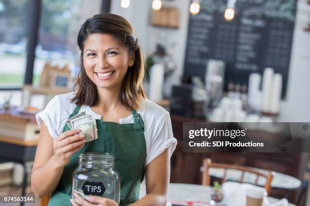 confident waitress with tip jar - gratuity stock pictures, royalty-free photos & images