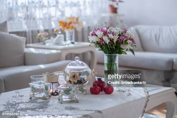 flowers on white table in room - freesia stockfoto's en -beelden