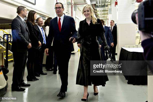 Steven Mnuchin, U.S. Treasury secretary, center, and his wife Louise Linton walk through the U.S. Bureau of Engraving and Printing in Washington,...