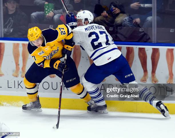 Jacob Moverare of the Mississauga Steelheads battles with Ivan Lodnia of the Erie Otters during game action on November 15, 2017 at Hershey Centre in...