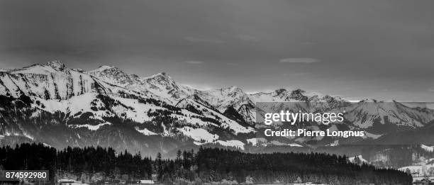 panoramic view on the vanil mountains, in the gruyere region of switzerland in winter - left to right:  dent de brenleire (2353m), dent de folliéran (2340m), vanil noir (2388,9m), vanil carré (2197m), view from the city of bulle, fribourg, switzerland - fribourg canton stock pictures, royalty-free photos & images