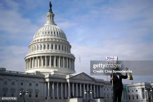 Demonstrator David Barrows joins a rally against the proposed Republican tax reform legislation on the east side of the U.S. Capitol November 15,...