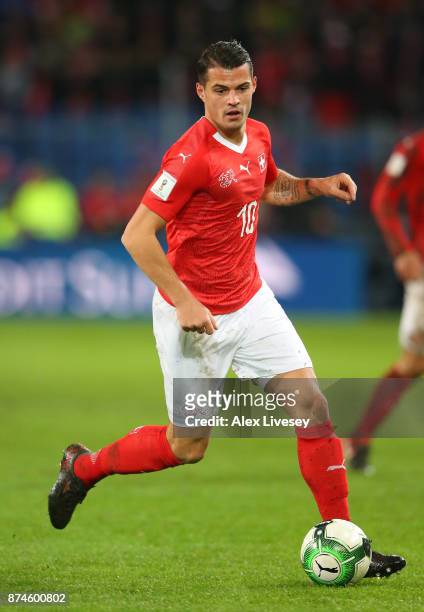 Granit Xhaka of Switzerland runs with the ball during the FIFA 2018 World Cup Qualifier Play-Off second leg match between Switzerland and Northern...