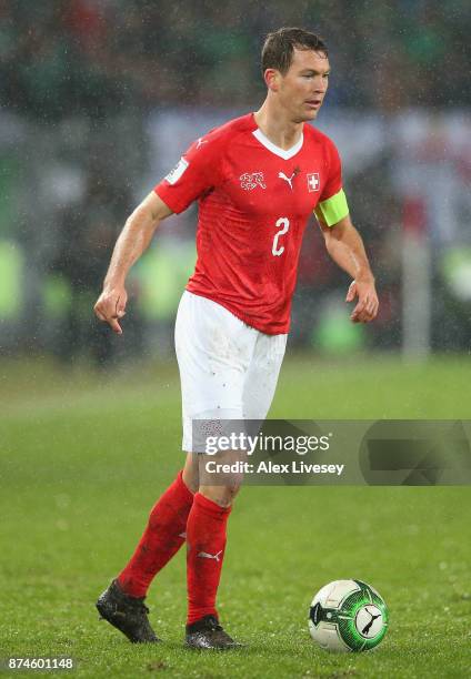 Stephan Lichtsteiner of Switzerland controls the ball during the FIFA 2018 World Cup Qualifier Play-Off second leg match between Switzerland and...