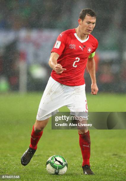 Stephan Lichtsteiner of Switzerland controls the ball during the FIFA 2018 World Cup Qualifier Play-Off second leg match between Switzerland and...