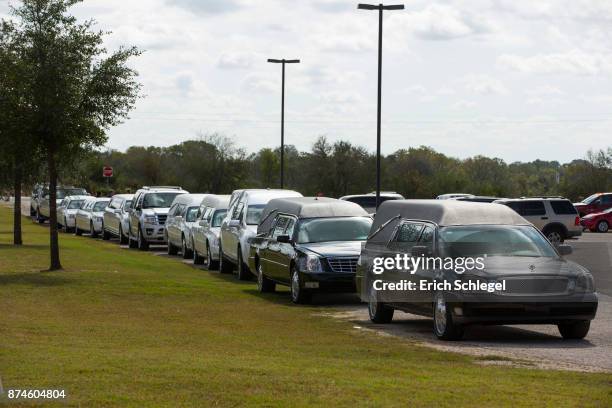 Hearses lined up for the memorial service held at the Floresville Events Center on November 15, 2017 in Floresville, Texas for the nine members of...