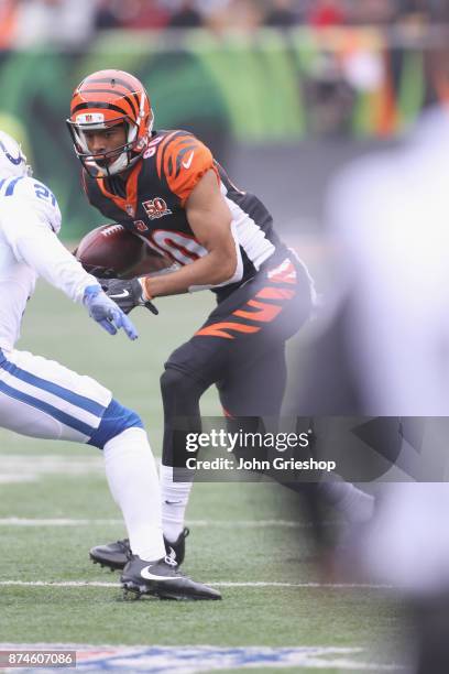 Josh Malone of the Cincinnati Bengals runs the football upfield during the game against the Indianapolis Colts at Paul Brown Stadium on October 29,...